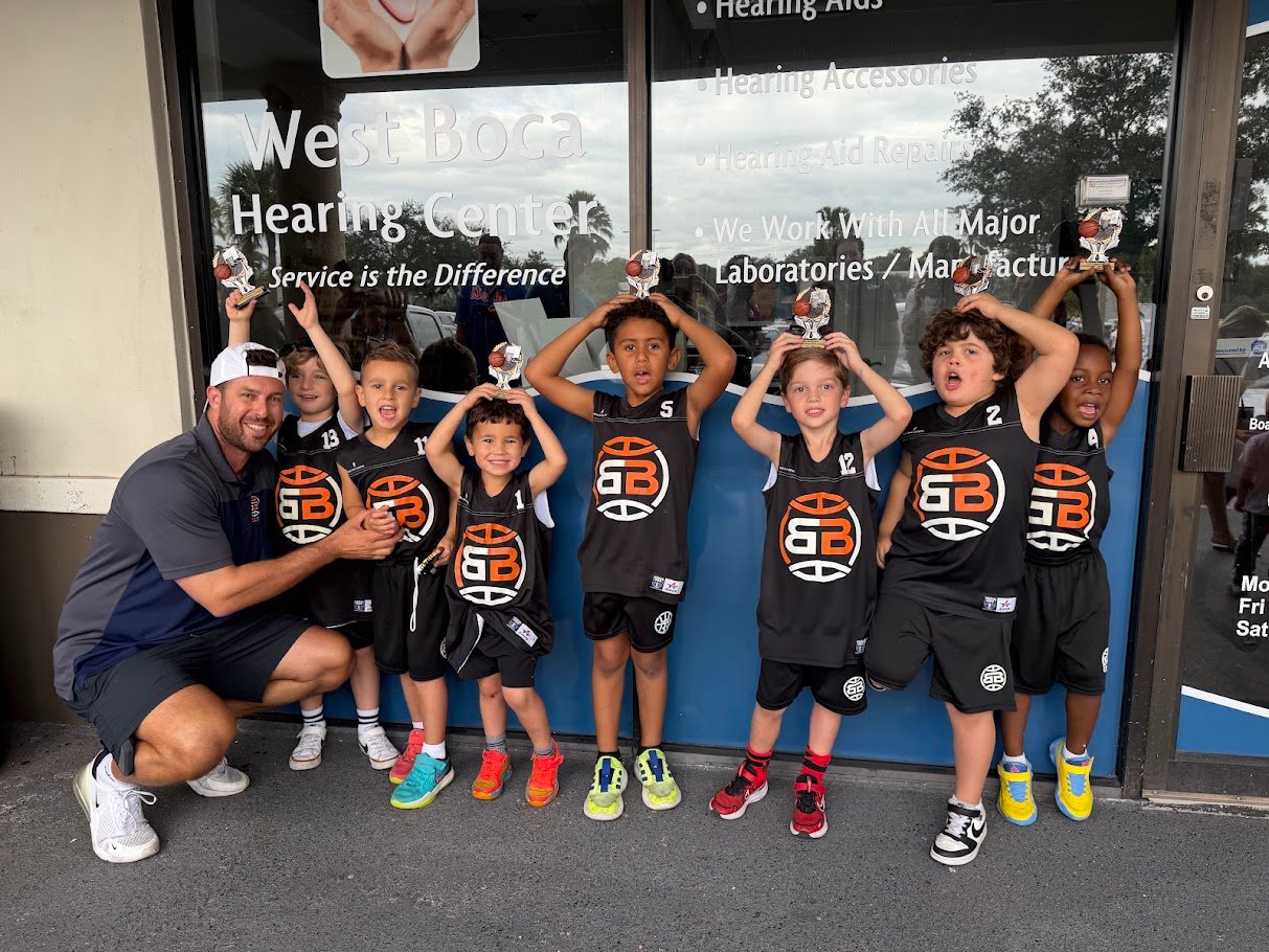 Boca Basketball kindergarten boys team with trophies and coach