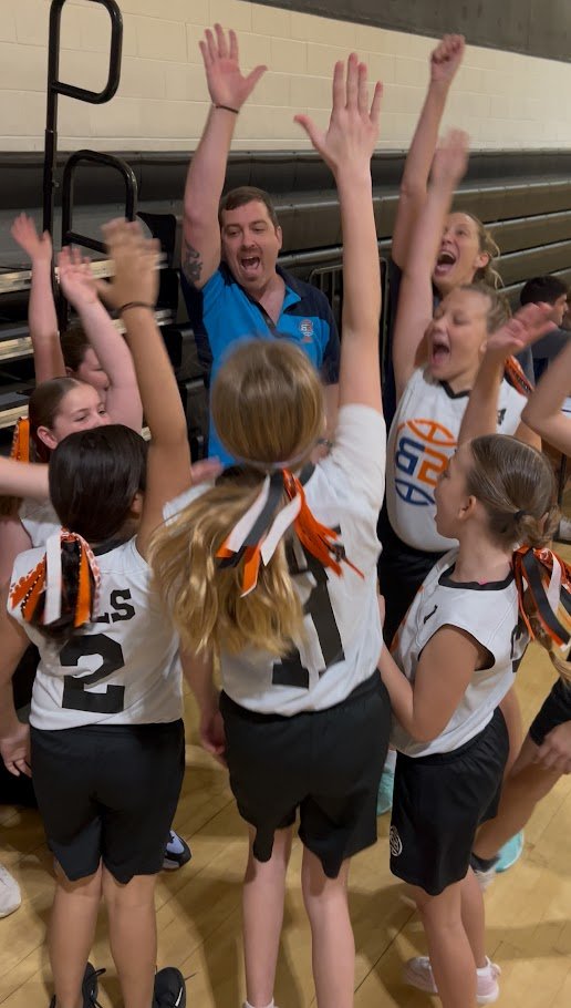 Girls competing in a Boca Basketball game at a Boca Raton indoor gym